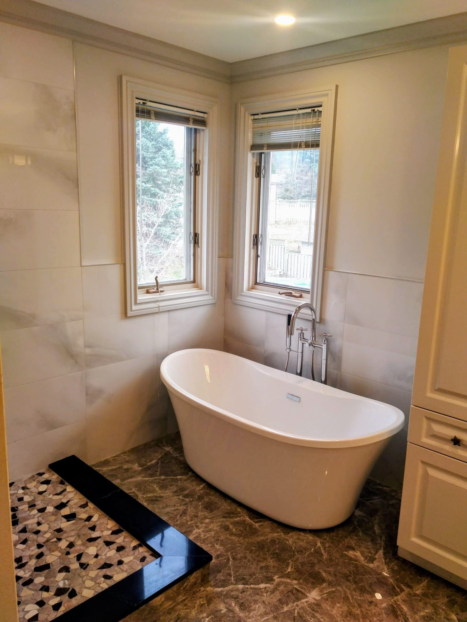 Professional plumber installing pipes in a residential bathroom renovation