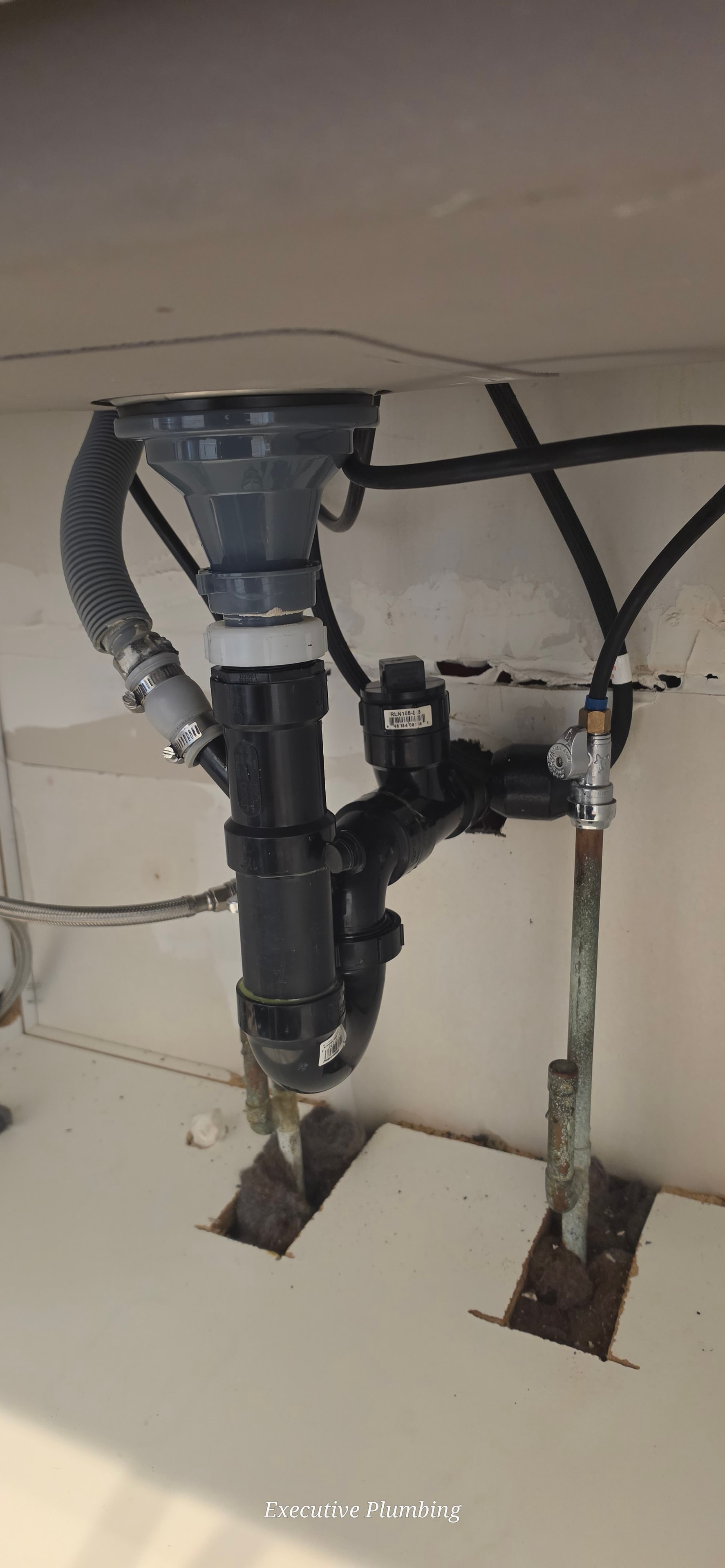 Under-sink drain plumbing