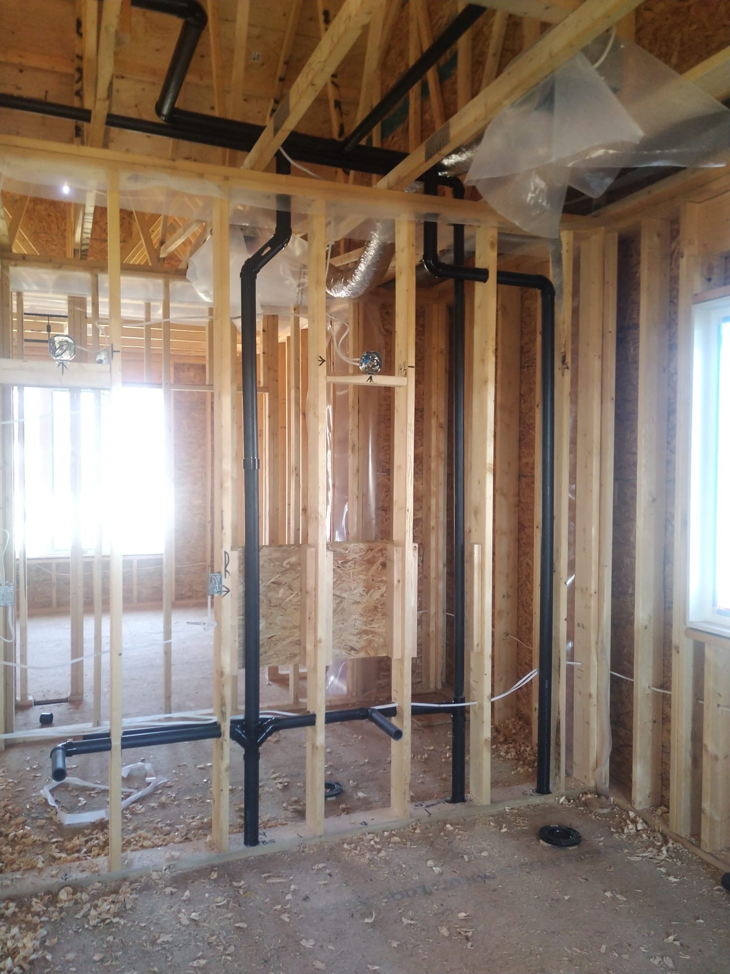 Plumber installing freestanding bathtub faucet